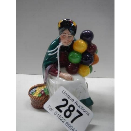 287 - Two Royal Doulton figurinesm - The Old Balloon Seller HN2129 and Biddy Penny Farthing HN1843.