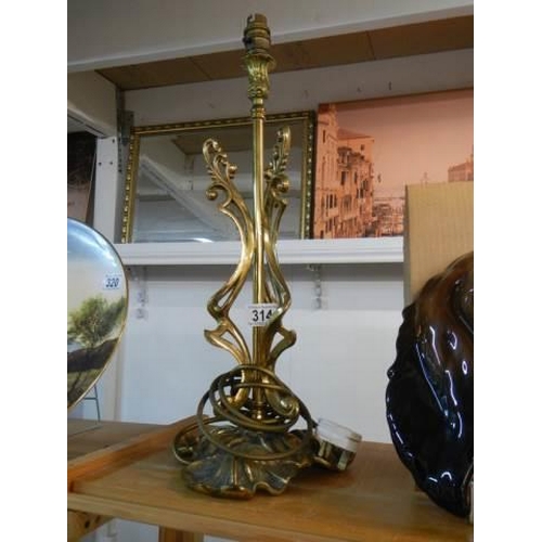 314 - A mid 20th century cast brass table lamp base, 50 cm tall.