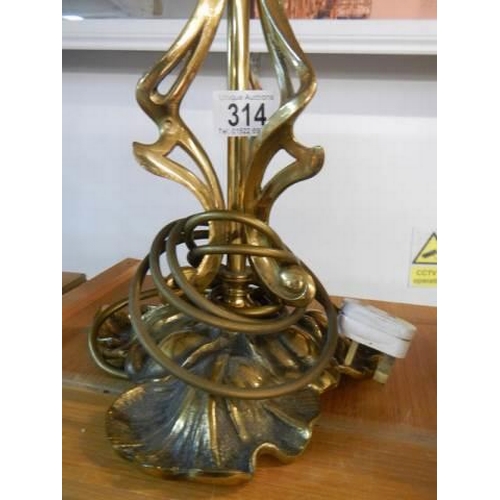 314 - A mid 20th century cast brass table lamp base, 50 cm tall.