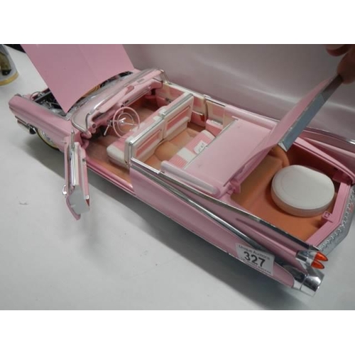 327 - A 1/12 scale pink Cadillac car.