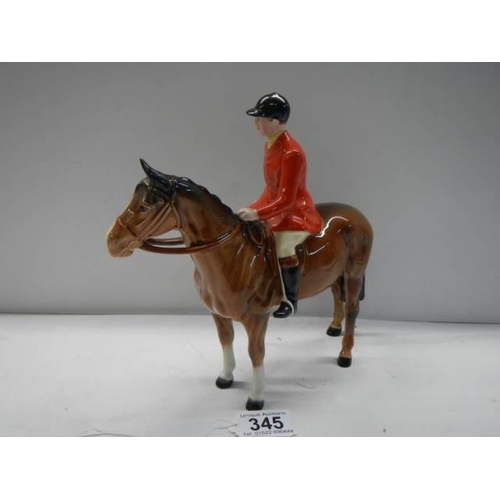 345 - A Beswick horse with red jacket huntsman, 22 cm