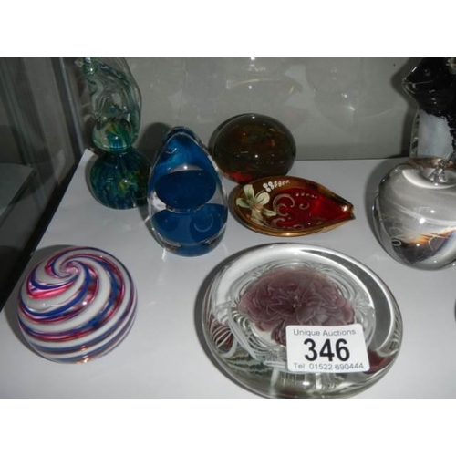 346 - A mixed lot of glass paperweights etc.,