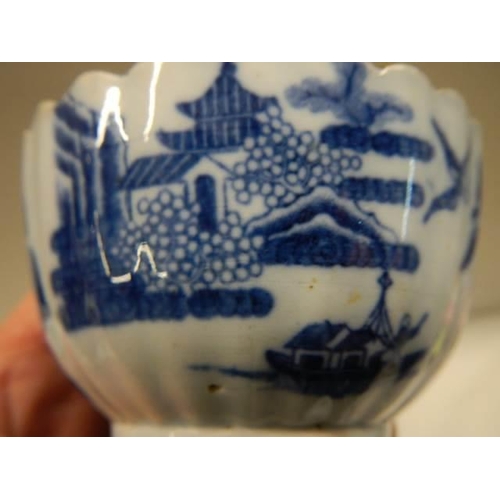 369 - Two early 19th century blue and white items - A Chinese cup circa 1800 and a tea bowl.