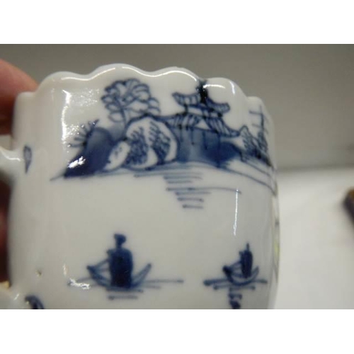 369 - Two early 19th century blue and white items - A Chinese cup circa 1800 and a tea bowl.