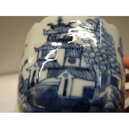 369 - Two early 19th century blue and white items - A Chinese cup circa 1800 and a tea bowl.