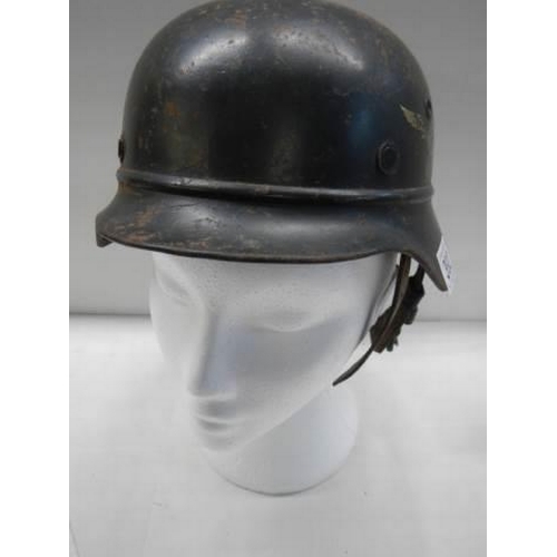 392 - A WW2 German Luftwaffe beaded helmet stamped NS64 DN30 with 'Ski Div Jungvolki' on liner and paper l... 