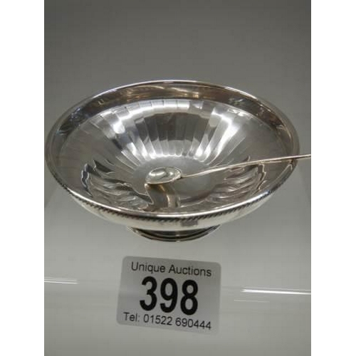 398 - A small silver dish with spoon.