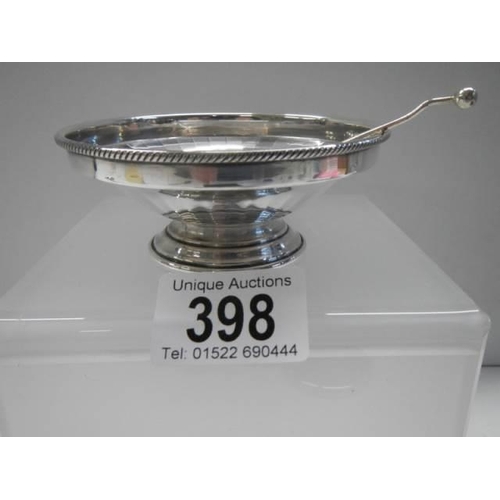 398 - A small silver dish with spoon.