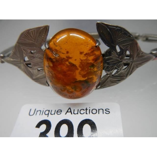 399 - A Danish silver bangle set amber.