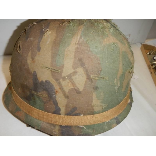 406 - A United States army Vietnam era helmet.