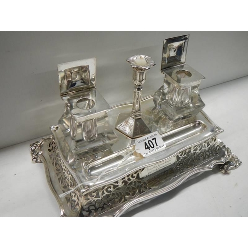 407 - A 19th century silver plate ink stand with glass inkwell, dated 1860.