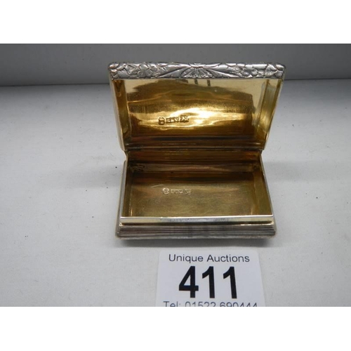 411 - A hall marked silver box with gilt interior. 62mm x 40mm x 19mm