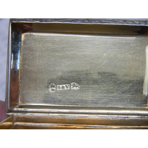 411 - A hall marked silver box with gilt interior. 62mm x 40mm x 19mm