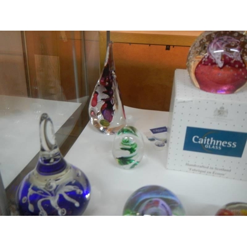 414 - A good lot of glass paperweights including Caithness.