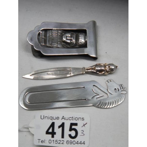 415 - Three silver book marks.