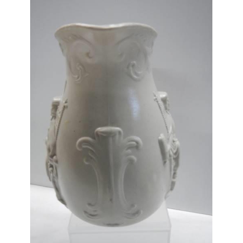 421 - An early embossed creamware jug featuring a King on a throne (possibly King Arthur), 24cm, in good c... 