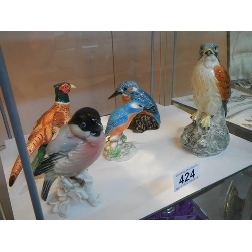 424 - A quantity of bird figures including Beswick.