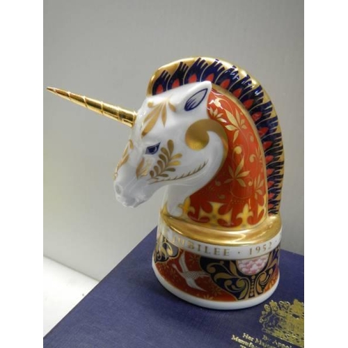 427 - A boxed pair of Royal Worcester candlesnuffers - The Lion and The Unicorn.