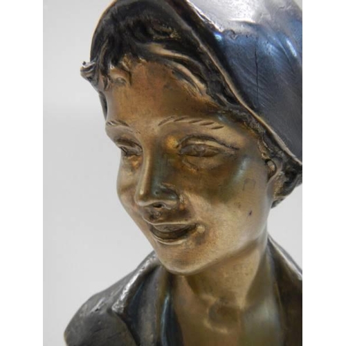 429 - A bronze bust of a female marked P M Milano, 20cm tall.