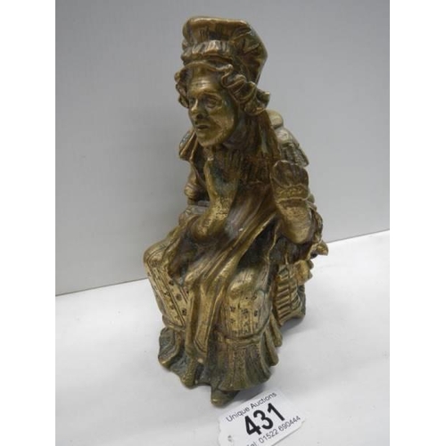 431 - A cast bronze figure of an elderly lady, 18cm