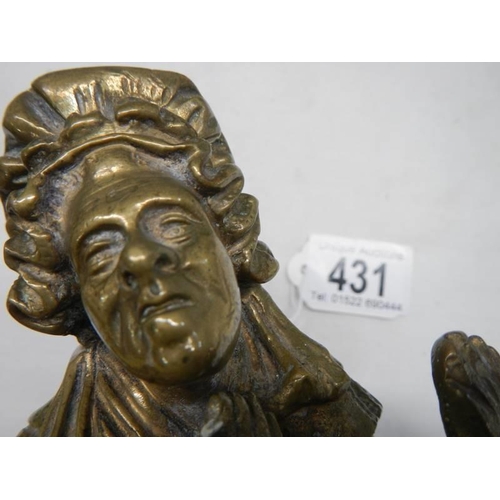 431 - A cast bronze figure of an elderly lady, 18cm