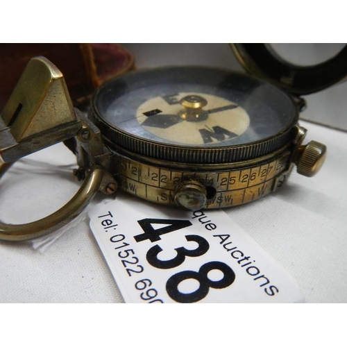 438 - A Swiss made pocket compass in leather pouch, marked Watts & Co., London 1911, No. 782, pouch a/f.