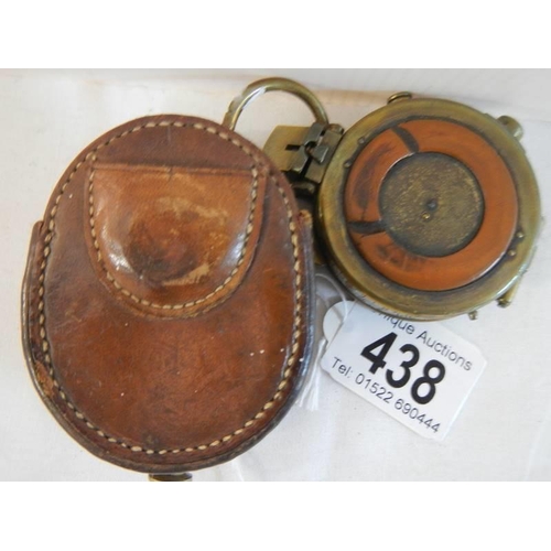 438 - A Swiss made pocket compass in leather pouch, marked Watts & Co., London 1911, No. 782, pouch a/f.