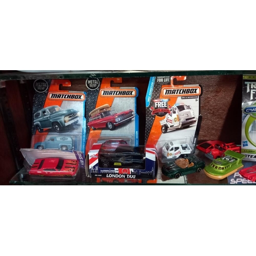 2073 - A quantity of mixed die cast including Matchbox, Siku & Transformers etc