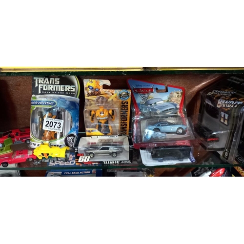 2073 - A quantity of mixed die cast including Matchbox, Siku & Transformers etc