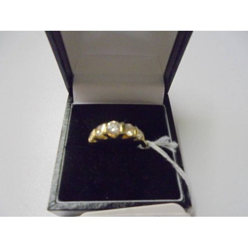 150U - A silver gilt ring set five clear stones, size P.