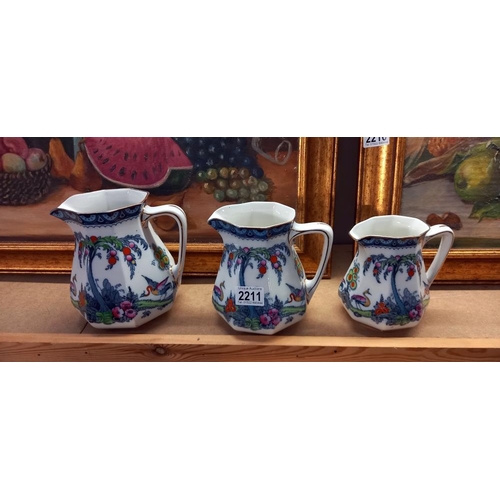 2211 - A set of 3 graduated Loso ware exotic pottery jugs