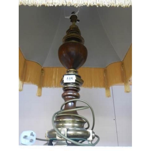 445 - A good quality brass and wood table lamp with fringed shade.