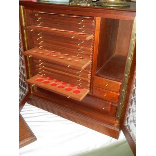 448 - A good quality lead glazed coin collectors cabinet. COLLECT ONLY.