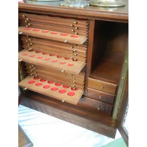 448 - A good quality lead glazed coin collectors cabinet. COLLECT ONLY.