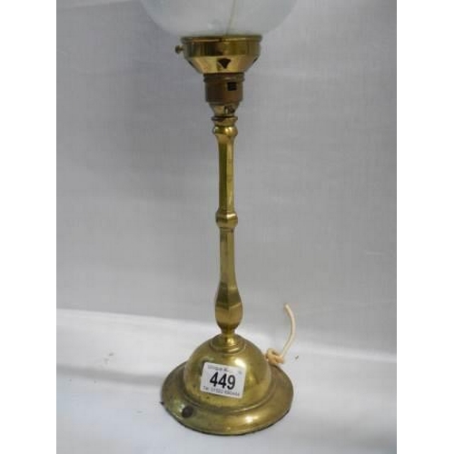 449 - An art deco brass table lamp with irridecent glass shade, needs re-wiring.