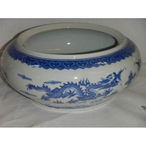 455 - A Chinese blue and white bowl decorated with dragons.