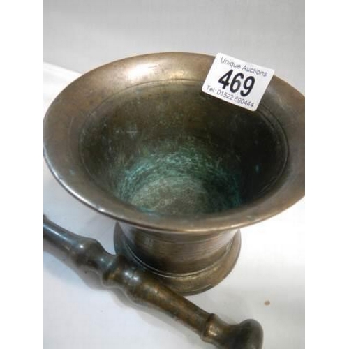 469 - A 19th century bronzed pestle and mortar.