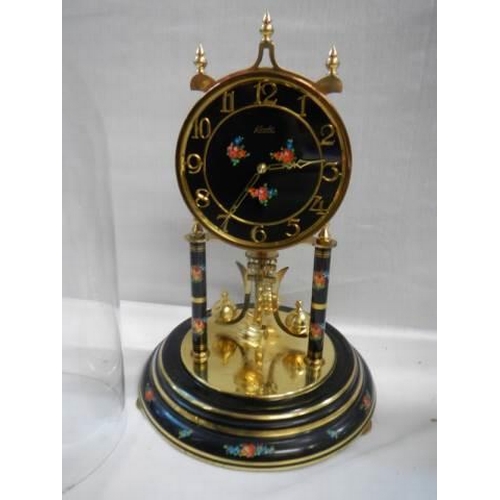 474 - A good Kundo anniversary clock under glass dome, in working order, COLLECT ONLY.