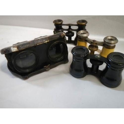 482 - Three pairs of opera glasses and a pair of early military glasses.