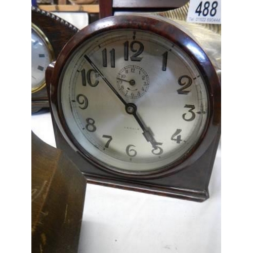 489 - Four good oak mantel clocks all in working order,