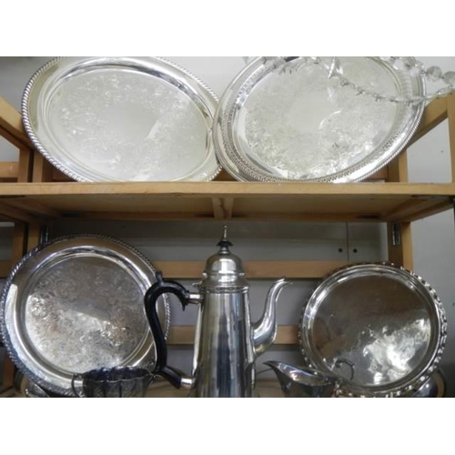 491 - Three shelves of good silver plate including trays, ladles, coffee pot, sauce boats etc.,