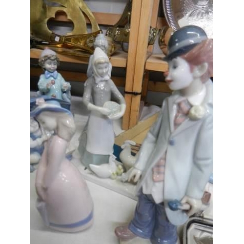 500 - Eight assorted figures including Lladro.