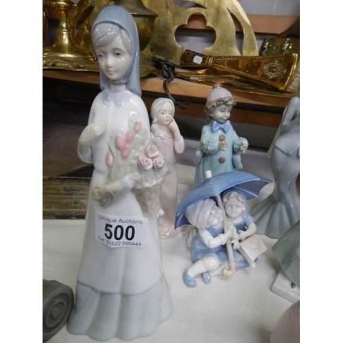 500 - Eight assorted figures including Lladro.