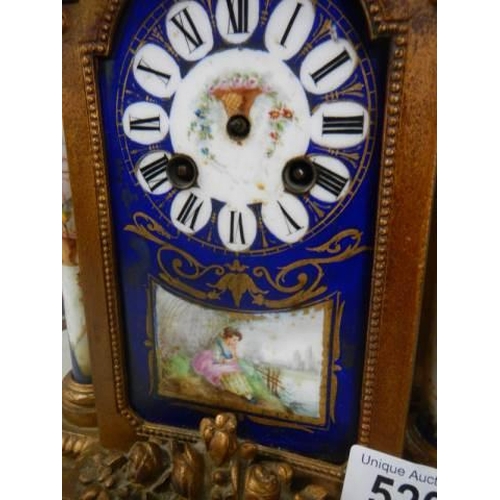 520 - A late 19th century French mantel clock with Sevres panesl, spring ok but missing hands.