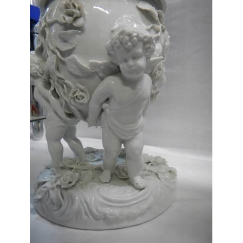 528 - A superb quality white glazed porcelain oil lamp surmounted with cherubs and with drop in font, COLL... 