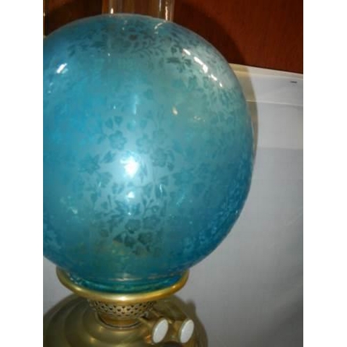 545 - A good Victorian oil lamp with original blue acid etched shade. COLLECT ONLY.