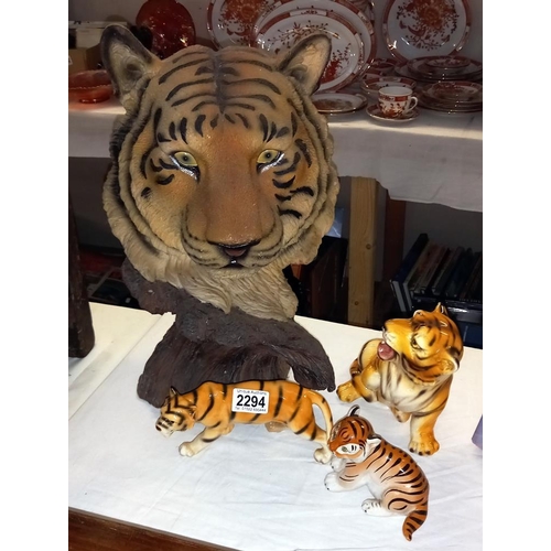 2294 - A large resin sculpture of a tiger and 3 china figures of tigers