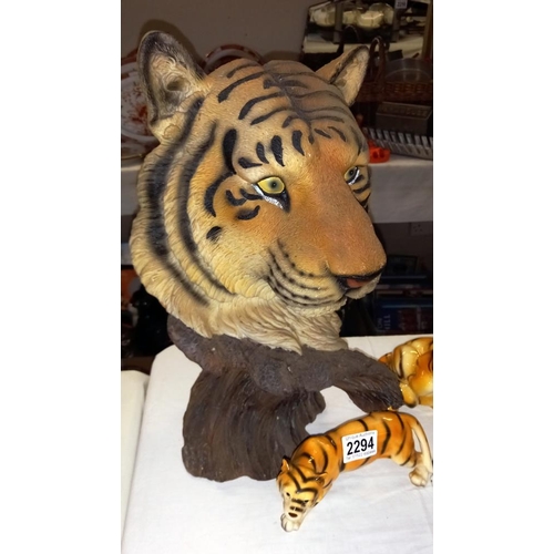 2294 - A large resin sculpture of a tiger and 3 china figures of tigers