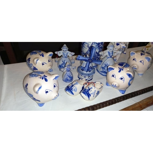 2297 - A quantity of hand painted Delft piggy banks etc