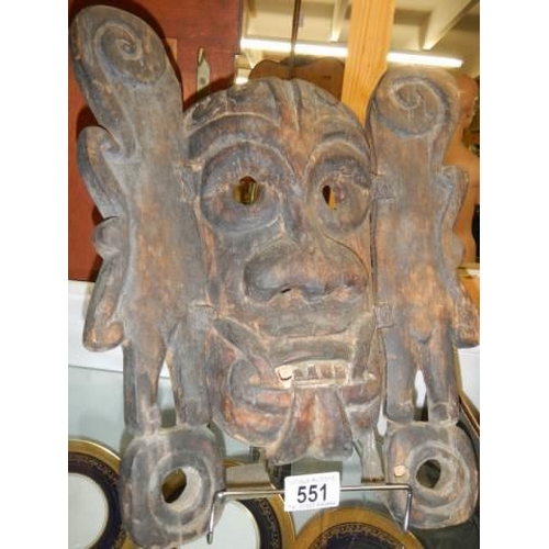 551 - An old carved wood tribal mask.